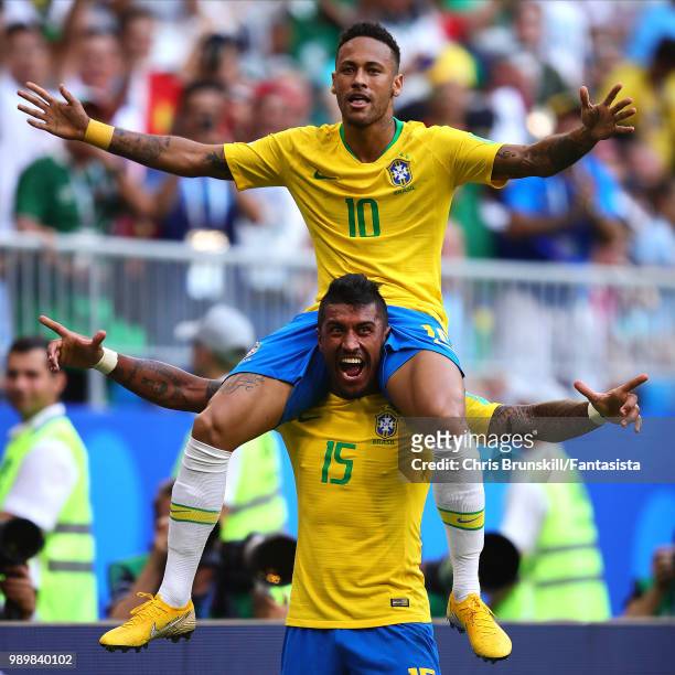 Neymar of Brazil celebrates scoring the opening goal with team-mate Paulinho during the 2018 FIFA World Cup Russia Round of 16 match between 1st...