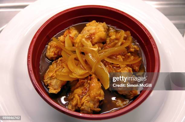 japanese fried chicken (karaage) curry with onion and pickled ginger on steamed rice - yōshoku stock pictures, royalty-free photos & images