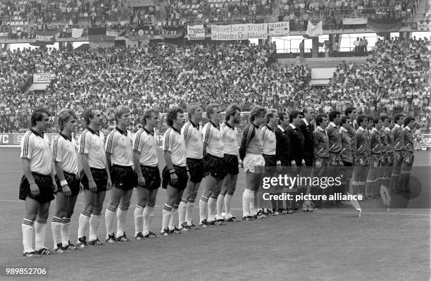 Line-up of the German and Algerian national football teams at the 1982 FIFA World Cup in Gijon's Molino stadium prior to the group match in front of...