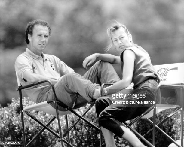 The German team manager Franz Beckenbauer with his wife Sybille are sharing a moment at the team hotel in Erba during the 1990 FIFA World Cup in...
