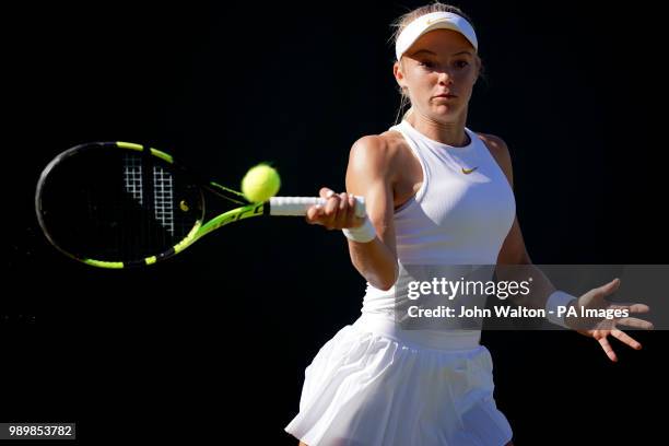 Katie Swan in action against Irina-Camelia Begu on day one of the Wimbledon Championships at the All England Lawn Tennis and Croquet Club, Wimbledon.