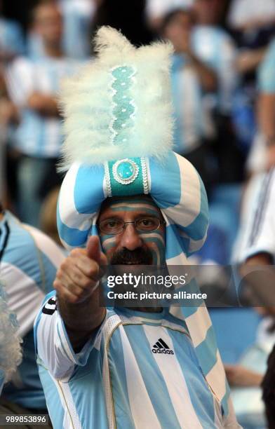 An Argentinian supporter cheers prior to the group C preliminary match of 2006 FIFA World Cup between Argentina and Ivory Coast in Hamburg, on...