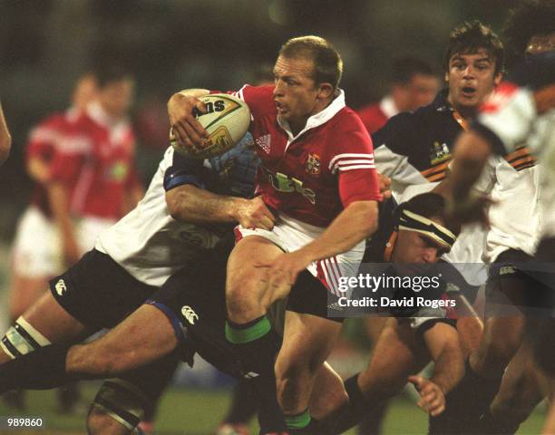 Matt Dawson of the British and Irish Lions is tackled by Angus Scott of the ACT Brumbies during the match between the British and Irish Lions and the...