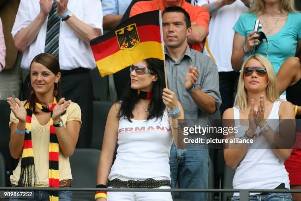 The wives and girlfriends of German soccer players behind the balustrade Sylwia Klose, Petra Frings and Lena, girlfriend of Tim Borowski during group...