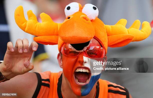 Dutch supporter wears an orange elk hat prior to the 2nd round match of the 2006 FIFA World Cup between Portugal and the Netherlands in Nuremberg,...