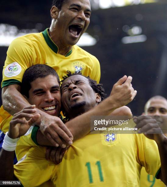 Ze Roberto from Brazil celebrates with teammates Ricardinho and Cafu after scoring the 3-0 lead against Ghana during the 2nd round match of the 2006...