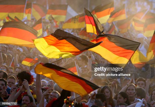 Supporters of Germany cheer during the FIFA World Cup 2006 semi final match against Italy on the supporter festival in Hamburg, Tuesday 04 July 2006....