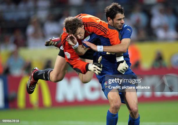 Jens Lehmann from Germany vies with Simone Perrotta from Italy during the semi final of the 2006 FIFA World Cup between Germany and Italy in...