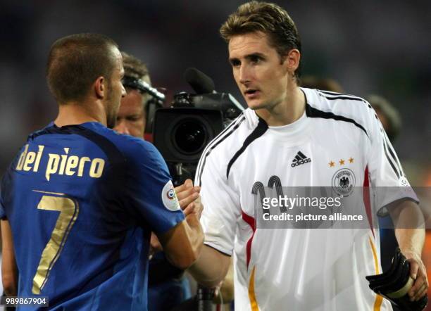 Miroslav Klose from Germany and Alessandro del Piero from Italy shake hands after the semi final of the 2006 FIFA World Cup between Germany and Italy...