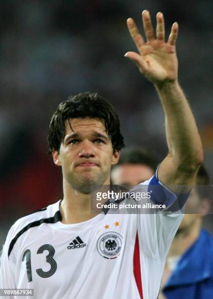 Dejceted German Michael Ballack with tears in his eyes walks off the pitch after the extra time of the semi final of the 2006 FIFA World Cup between...