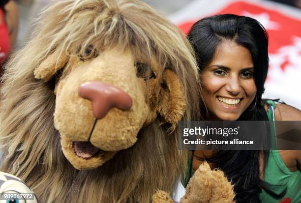 Jaciara da Souza, wife of portuguese player Anderson "Deco" de Souza, poses with mascot "Goleo" prior to the semi final match of the 2006 FIFA World...