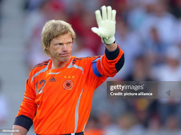 German goalkeeper Oliver Kahn waves during the 3rd place match of the 2006 FIFA World Cup between Germany and Portugal in Stuttgart, Germany,...