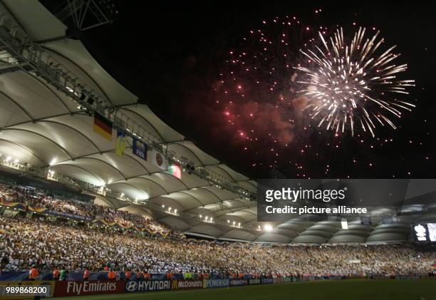 Firework seen over the FIFA stadium after the 3rd place match of the 2006 FIFA World Cup between Germany and Portugal in Stuttgart, Germany, Saturday...