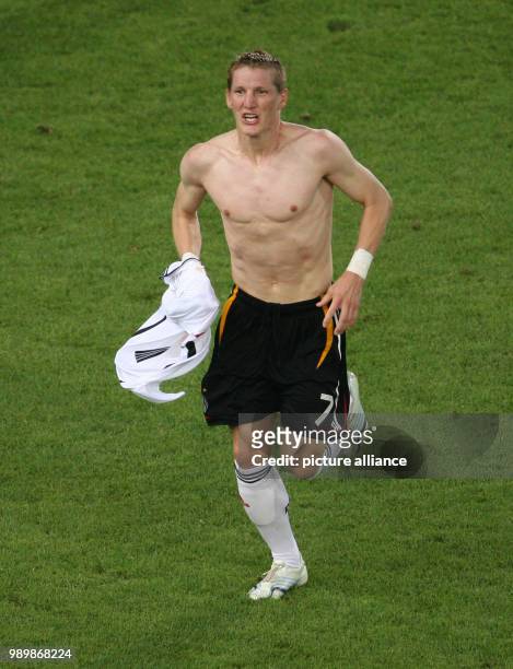 German scorer Bastian Schweinsteiger celebrates after a goal during the 3rd place match of the2006 FIFA World Cup between Germany and Portugal in...