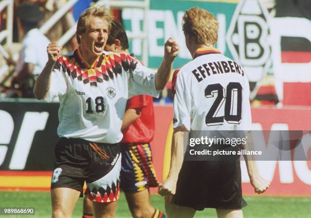 German striker Juergen Klinsmann is celebrating his equalising goal against Spain with teammate Stefan Effenberg. The match ends with a 1:1 tie.