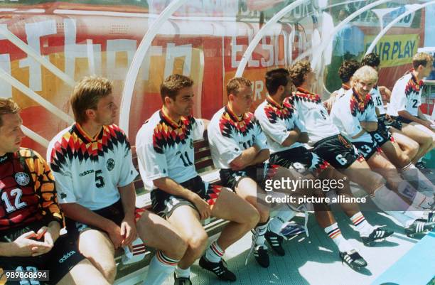 German substitute players: Andreas Koepke, Thomas Helmer, Stefan Kuntz, Martin Wagner, Ulf Kirsten, Guido Buchwald and Rudi Voeller are sitting on...