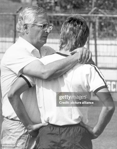 German team coach Jupp Derwall and football player Pierre Littbarski during practice at the World Cup in Spain.
