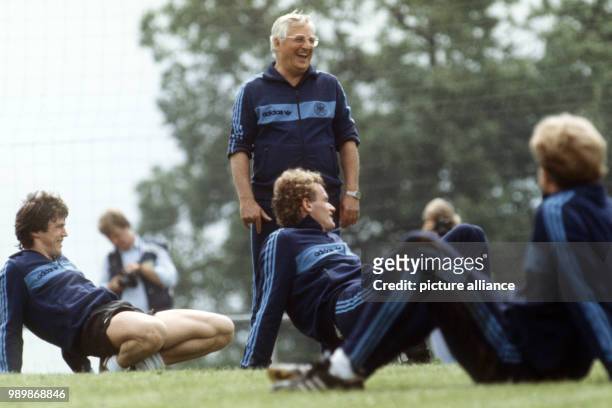 German team coach Jupp Derwall at the practice with team members Klaus Fischer, Hans-Peter Briegel and Karl-Heinz Rummenigge during the World Cup in...