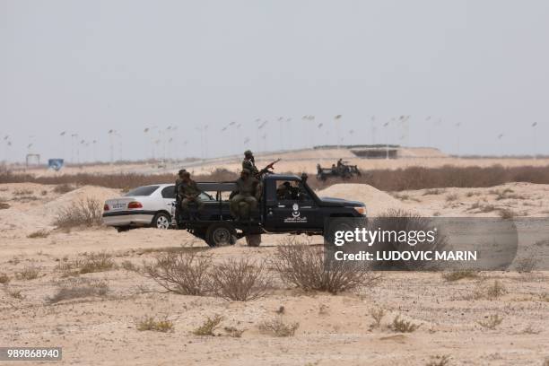 Members of the Mauritanian security forces guard the area close to the Mourabitoune International Conference Center where the African Union summit is...