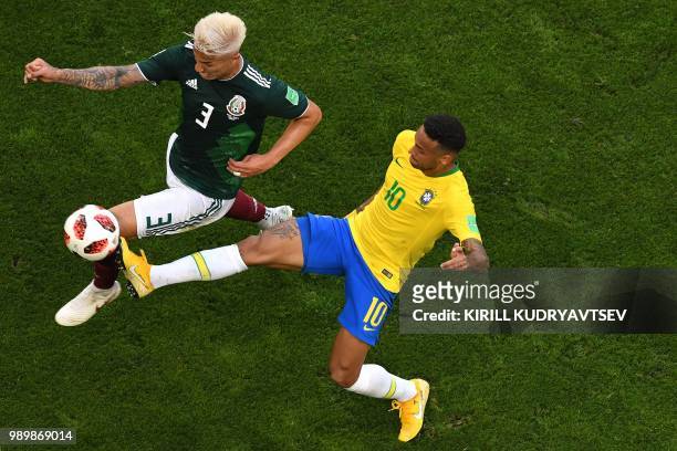 Mexico's defender Carlos Salcedo vies with Brazil's forward Neymar during the Russia 2018 World Cup round of 16 football match between Brazil and...