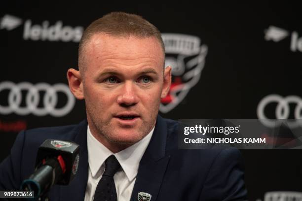 United's new recruit British footballer Wayne Rooney speaks at a press conference in Washington, DC, on July 2, 2018.