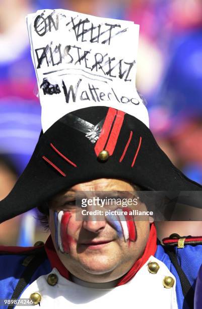 French fan is dressed up as Napoleon and wrote the word "Waterloo" on his hat.