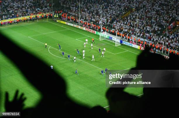 World Cup, Germany - Italy. Italian players are celebrating their 1:0 by Fabio GROSSO. German fans in the front cannot believe their team's...
