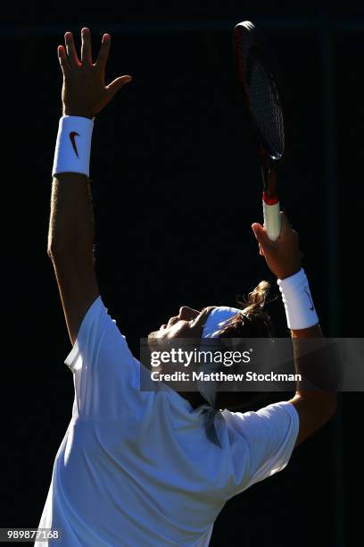 Jared Donaldson of the United States serves against Malek Jaziri of Tunisia on day one of the Wimbledon Lawn Tennis Championships at All England Lawn...