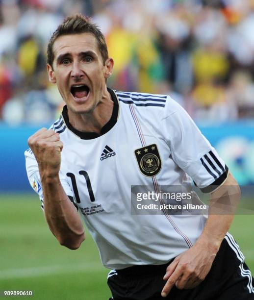 Miroslav Klose of Germany celebrates after scoring the 1-0 during the 2010 FIFA World Cup round of 16 match between Germany and England at the Free...
