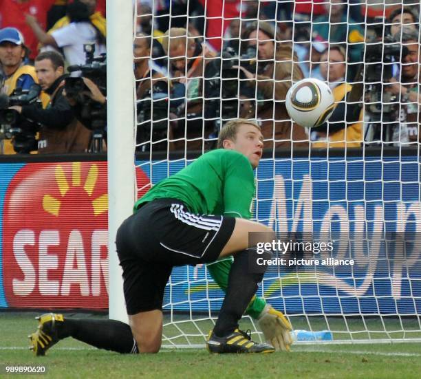 Germany's goalkeeper Manuel Neuer tries to save a shot by Lampard during the 2010 FIFA World Cup round of 16 match between Germany and England at the...