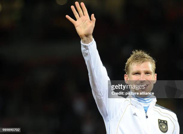 Per Mertesacker of Germany celebrates after the 2010 FIFA World Cup third place match between Uruguay and Germany at the Nelson Mandela Bay Stadium...