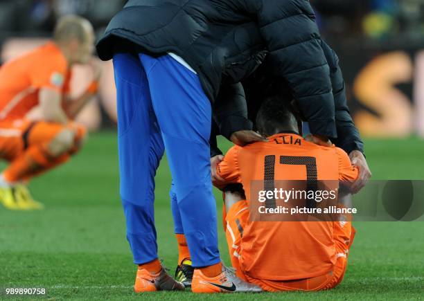 Dutch Eljero Elia sits on the pitch after the 2010 FIFA World Cup final match between the Netherlands and Spain at Soccer City Stadium in...