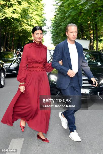 Giovanna Battaglia and Oscar Engelbert are seen at the Giambattista Valli Haute Couture Fall Winter 2018/2019 Show on July 2, 2018 in Paris, France.