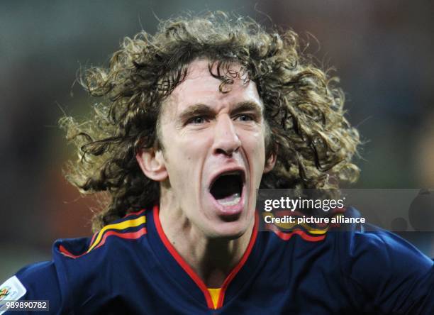 Carles Puyol of Spain celebrates after the final whistle of the 2010 FIFA World Cup final match between the Netherlands and Spain at the Soccer City...
