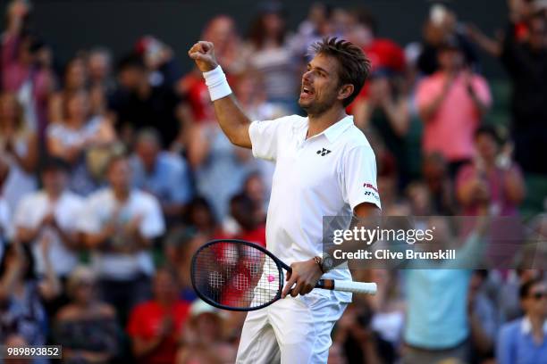 Stanislas Wawrinka of Switzerland celebrates match point against Grigor Dimitrov of Bulgaria during their Men's Singles first round match on day one...