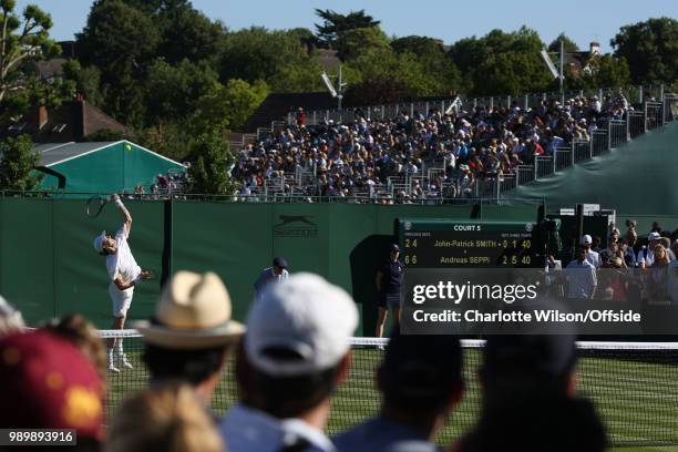 John-Patrick Smith serves against Andreas Seppi at All England Lawn Tennis and Croquet Club on July 2, 2018 in London, England.