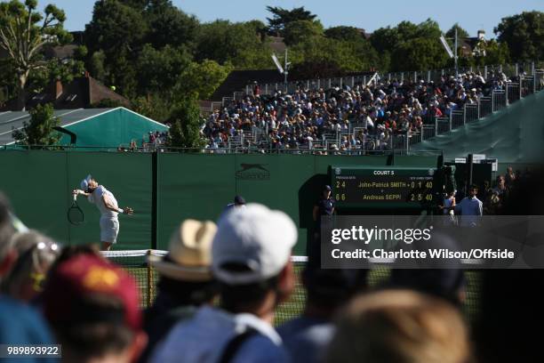 John-Patrick Smith serves against Andreas Seppi at All England Lawn Tennis and Croquet Club on July 2, 2018 in London, England.