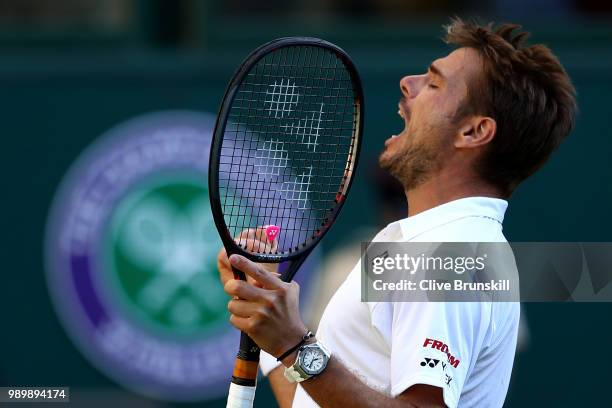 Stanislas Wawrinka of Switzerland celebrates match point against Grigor Dimitrov of Bulgaria during their Men's Singles first round match on day one...