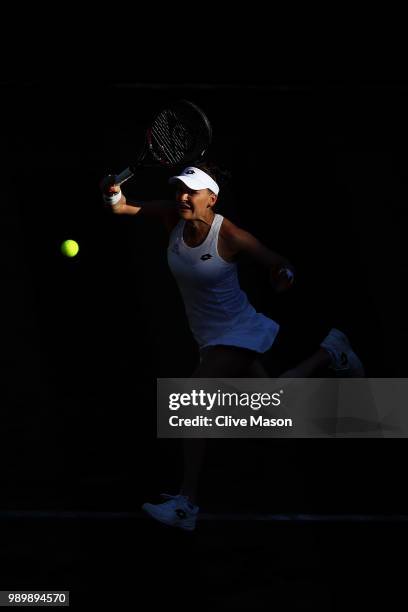 Agnieszka Radwanska of Poland returns against Elena-Gabriela Ruse of Romania during their Ladies' Singles first round match on day one of the...