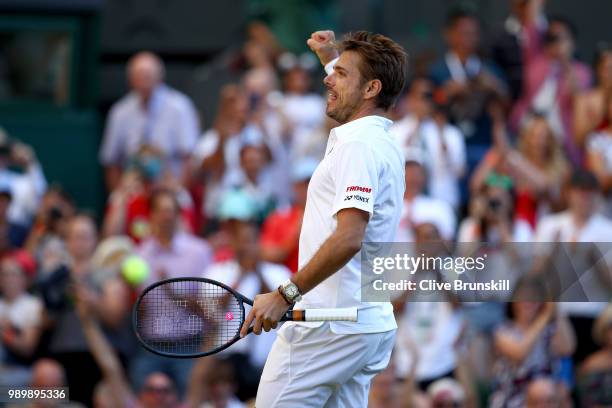 Stanislas Wawrinka of Switzerland celebrates match point against Grigor Dimitrov of Bulgaria during their Men's Singles first round match on day one...