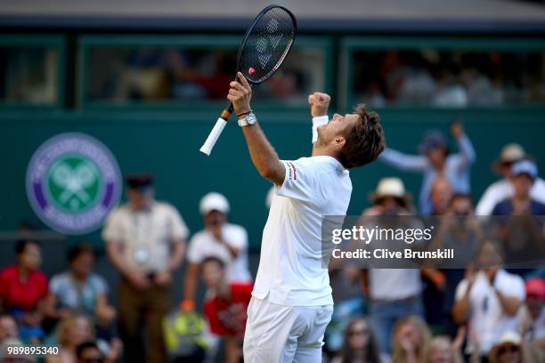 Stanislas Wawrinka of Switzerland celebrates match point against Grigor Dimitrov of Bulgaria during their Men's Singles first round match on day one...