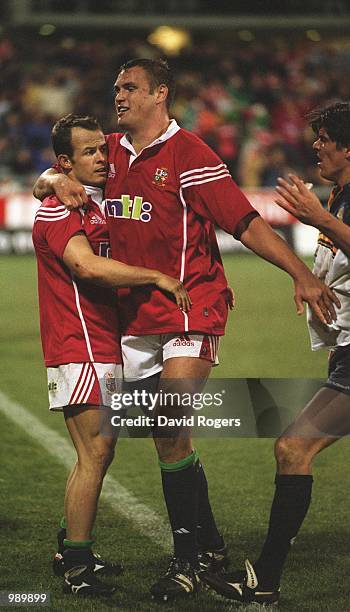 Austin Healey of the British and Irish Lions and Jeremy Davidson leave the field after match between the British and Irish Lions and the ACT Brumbies...