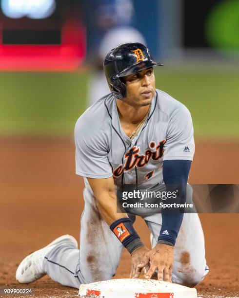 Detroit Tigers Center fielder Leonys Martin after diving safely back to first on a Toronto Blue Jays Pitcher Joe Biagini pick-off attempt during the...