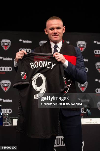 United's new recruit British footballer Wayne Rooney speaks at a press conference in Washington, DC, on July 2, 2018.
