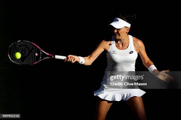 Agnieszka Radwanska of Poland returns against Elena-Gabriela Ruse of Romania on day one of the Wimbledon Lawn Tennis Championships at All England...