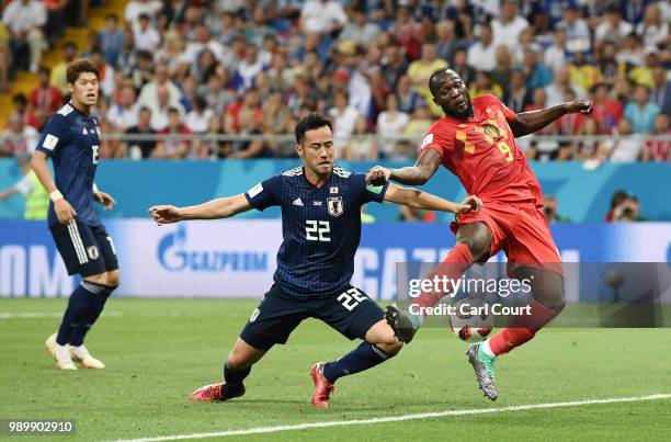 Romelu Lukaku of Belgium fails to connect with the ball in the box under pressure from Maya Yoshida of Japan during the 2018 FIFA World Cup Russia...