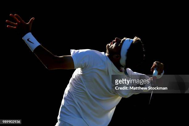 Jared Donaldson of the United States serves against Malek Jaziri of Tunisia on day one of the Wimbledon Lawn Tennis Championships at All England Lawn...