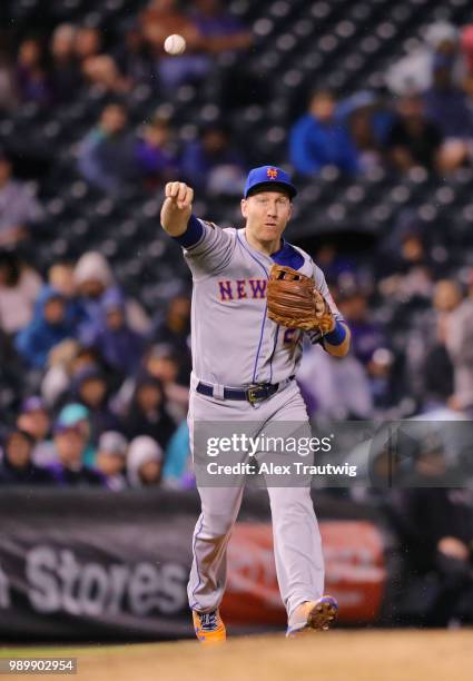 Todd Frazier of the New York Mets throws to first base during a game against the Colorado Rockies at Coors Field on Tuesday, June 19, 2018 in Denver,...