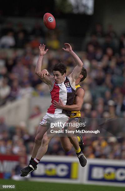 Stephen Milne for St Kilda tackled by Darren Glass for West Coast, during round 18 of the AFL season, played at Subiaco Oval in Perth, Australia.West...