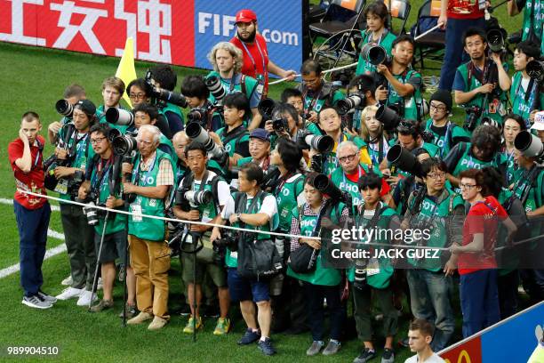 Photographers wait for the start of the Russia 2018 World Cup round of 16 football match between Belgium and Japan at the Rostov Arena in...